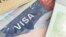 USA visa in a passport - selective focus - macro background Shutterstock
