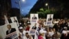 Armenia - Demonstrators hold pictures of jailed Russian-Armenian billionaire Samvel Karapetian, Yerevan, July 4, 2025.