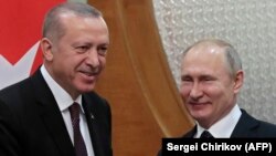 Russian President Vladimir Putin (right) meets with Turkish counterpart Recep Tayyip Erdogan in the Black Sea resort of Sochi on February 14.