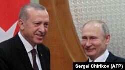 Russian President Vladimir Putin (right) meets with his Turkish counterpart, Recep Tayyip Erdogan, in the Black Sea resort of Sochi on February 14.