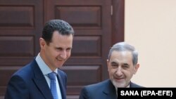 SYRIA -- Syrian President Bashar Assad (L) meets with Akbar Velayati, a top adviser to Iran's supreme leader, in Damascus, April 12, 2018