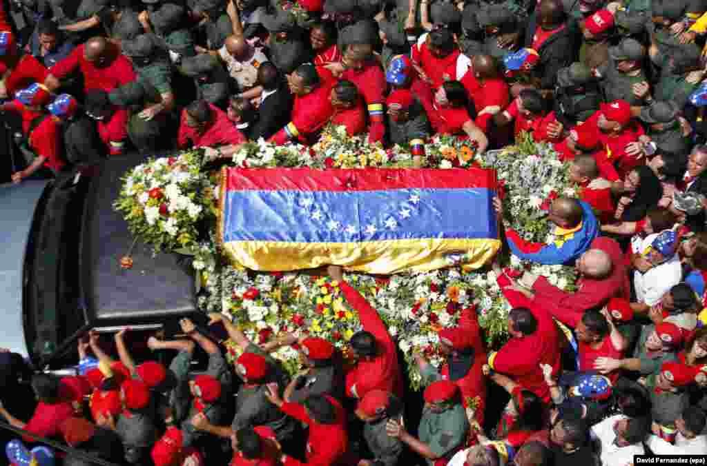 A vehicle carries a coffin with the remains of late Venezuelan President Hugo Chavez through the streets of Caracas on March 6. Chavez died on March 5 at the age of 58.