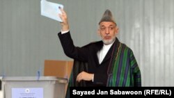 President Hamid Karzai casts his ballot at a voting station in Kabul.