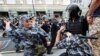 A Russian national guardsman beats a protester with a rubber baton during protests in Moscow. <strong><a href="https://www.facebook.com/novgaz/videos/456931174812722/" target="_blank">Video of the incident</a></strong> show the guardsman striking the detained man twice with full force, before a bystander punches the riot policeman on right.&nbsp;