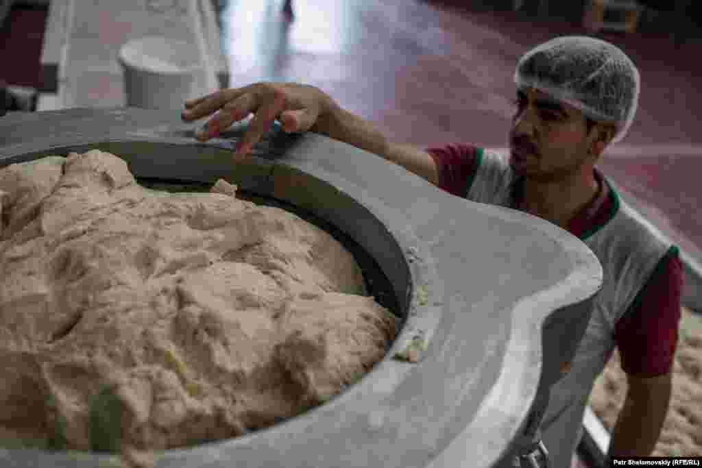 They bake 100,000 loaves of bread every day to feed 50,000 people in the camps on the Syrian side of the border.