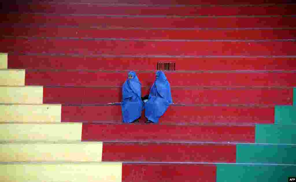 Afghan women sit in the bleachers at a women's Taekwon-Do match in Herat. (AFP/Aref Karimi)