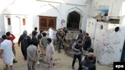 File photo of a recent attack on a Shi'ite mosque in Pakistan.