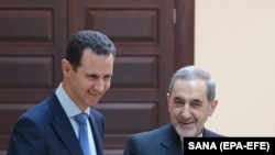 SYRIA -- Syrian President Bashar Assad (L) meets with Akbar Velayati, a top adviser to Iran's supreme leader, in Damascus, April 12, 2018