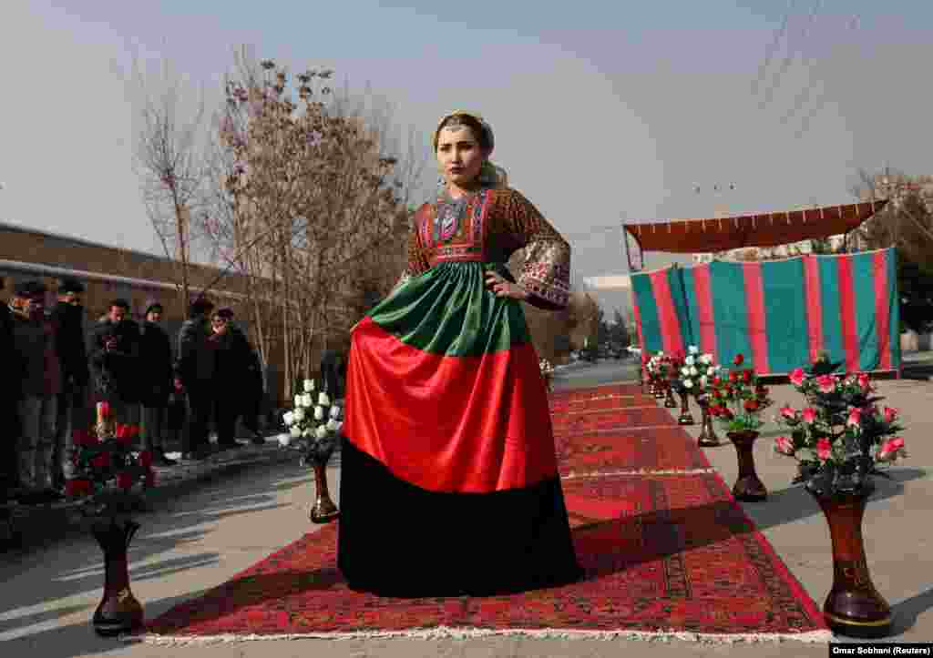 An Afghan model presents a traditional costume during Kabul&#39;s first street fashion show on January 23. (Reuters/Omar Sobhani)