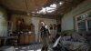 ARMENIA -- Aram Vardazaryan stands inside his home which suffered of bombing attacks in the village of Aygepar, Tavush region, recently damaged by shelling during armed clashes on the Armenian-Azerbaijani border, July 18, 2020