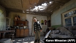 ARMENIA -- Aram Vardazaryan stands inside his home which suffered of bombing attacks in the village of Aygepar, Tavush region, recently damaged by shelling during armed clashes on the Armenian-Azerbaijani border, July 18, 2020