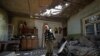 ARMENIA -- Aram Vardazaryan stands inside his home in the village of Aygepar recently damaged by shelling during armed clashes on the Armenian-Azerbaijani border, July 18, 2020.