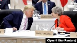 Британската премиерка Тереза Меј и американскиот претседател Доналд Трамп. Архивска фотографија.  