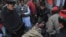 Rescuers move an injured man into a hospital following the attack on Bacha Khan university in Charsadda on January 20.