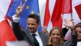 Polish presidential candidate Rafal Trzaskowski (left) holds an election rally in the city of Plock on May 11.