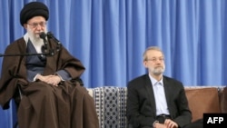 Iranian national security chief Ali Larijani (right) with Iranian Supreme Leader Ayatollah Ali Khamenei (file photo)