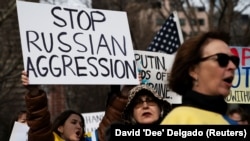 People participate in a "Stand With Ukraine" rally outside the United Nations in New York on February 17.