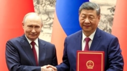 Кіраўнікі Расеі і Кітая Ўладзімір Пуцін і Сі Дзіньпін пасьля перамоваў у Пэкіне, 20 траўня 2026 году