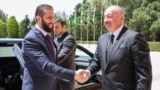 This handout picture released by the Syrian Presidency shows Azerbaijan's President Ilham Aliyev (right) receiving Syria's interim President Ahmed al-Sharaa in Baku on July 12.