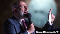 Armenian acting Prime Minister Nikol Pashinian delivers a speech during a rally in central Yerevan on June 21