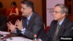 Armenia - Prime Minister Tigran Sarkisian (L) and U.S. Ambassador John Heffern attend a conference in Yerevan, 14Jun2013.