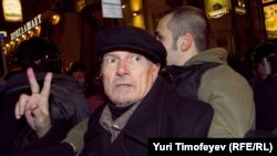 Police detain Eduard Limonov of the unregistered Other Russia party during a rally to protest the parliamentary election results in Moscow on December 6.