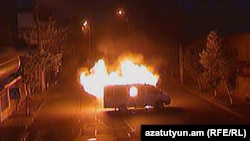 Armenia - A police van is set on fire by gunmen occupying a police station in Yerevan, 24July, 2016