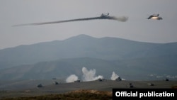 Nagorno-Karabakh - Armenian Mi-24 helicopters fire rockets during military exercises, 14Nov2014.