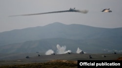 Nagorno-Karabakh - Armenian Mi-24 helicopters fire rockets during military exercises, 14Nov2014.