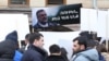 Armenia - Protesters hold a picture of Ruben Vardanyan outside the ICRC office in Yerevan, March 3, 2025.