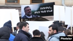 Armenia - Protesters hold a picture of Ruben Vardanyan outside the ICRC office in Yerevan, March 3, 2025.