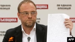 Serhiy Vlasenko, a lawyer for Yulia Tymoshenko, displays a letter she wrote to the President Viktor Yanukovych during a press conference in Kyiv in October.