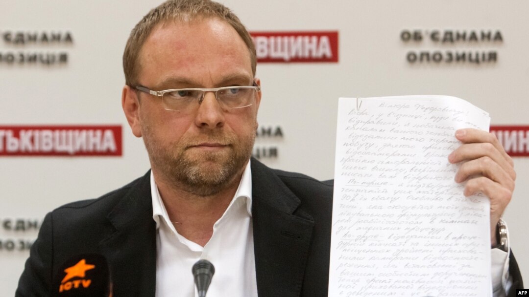 Serhiy Vlasenko, a lawyer for Yulia Tymoshenko, displays a letter she wrote to the President Viktor Yanukovych during a press conference in Kyiv in October.