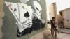 A member of the Iraqi security forces stands guard at a camp between the cities of Fallujah and Ramadi.