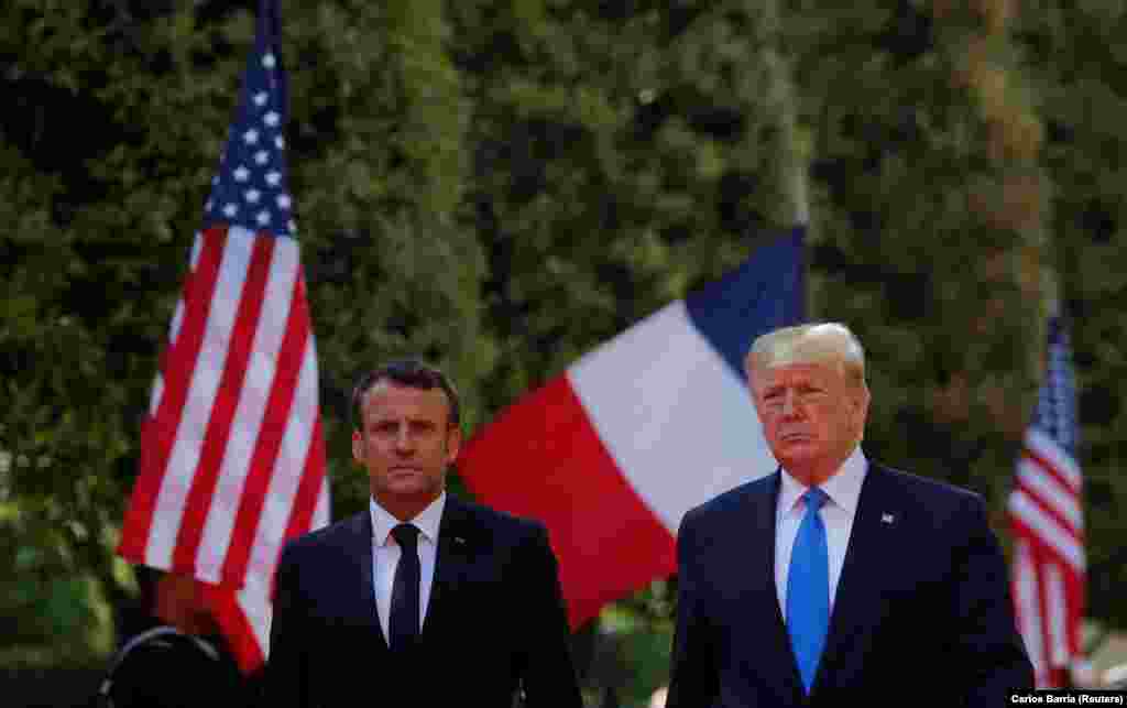 FRANCE -- U.S President Donald Trump and French President Emmanuel Macron attend a French-American commemoration ceremony for the 75th anniversary of D-Day at the American cemetery of Colleville-sur-Mer in Normandy, June 6, 2019