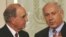 Israeli Prime Minister Binyamin Netanyahu (right) meets with U.S. envoy George Mitchell in Jerusalem.