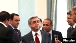 Armenia -- President Serzh Sarkisian and his coalition partners celebrate the signing of a declaration endorsing his reelection bid, 17Feb2011.