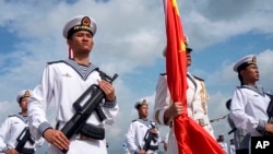 Chinese military sailors attend a welcome ceremony for a joint naval exercise with Russian forces in Zhanjiang, China, in July.