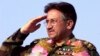 Pervez Musharraf salutes at a public rally in 2002 in Lahore, Pakistan.