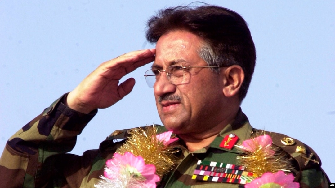 Pervez Musharraf salutes at a public rally in 2002 in Lahore, Pakistan.
