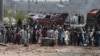 Supporters of Tehrik-e Labaik Pakistan (TLP) block a street in protest after their leader was detained following his calls for the expulsion of the French ambassador, in Lahore on April 18.