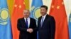 Kazakh President Nursultan Nazarbayev (L) and Chinese President Xi Jinping shake hands before their meeting at the Great Hall of the People, on the sidelines of the Belt and Road forum in Beijing on May 14.