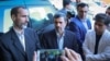 Mahmoud Ahmadinejad (C) and his former deputy Hamid Baghaei. File photo