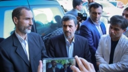 A recent photo showing Iranian former president Mahmoud Ahmadinejad with his aides.