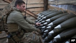 A Ukrainian officer inspects ammunition in a shelter on the front line in the Kharkiv region. (file photo)