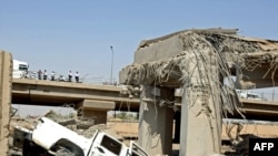 A damaged bridge following a massive explosion near the Finance Ministry in Baghdad on August 19.