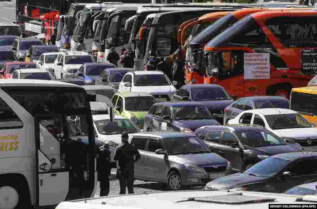 Buses and cars parked by Ukrainian small business owners during a protest in Kyiv on May 13 who were demanding they be allowed to return to work.