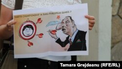 Chisinau: A demonstrator holds a poster during a protest at the Azerbaijani Embassy against the verdict in the case of Khadija Ismayilova.3Sep2015