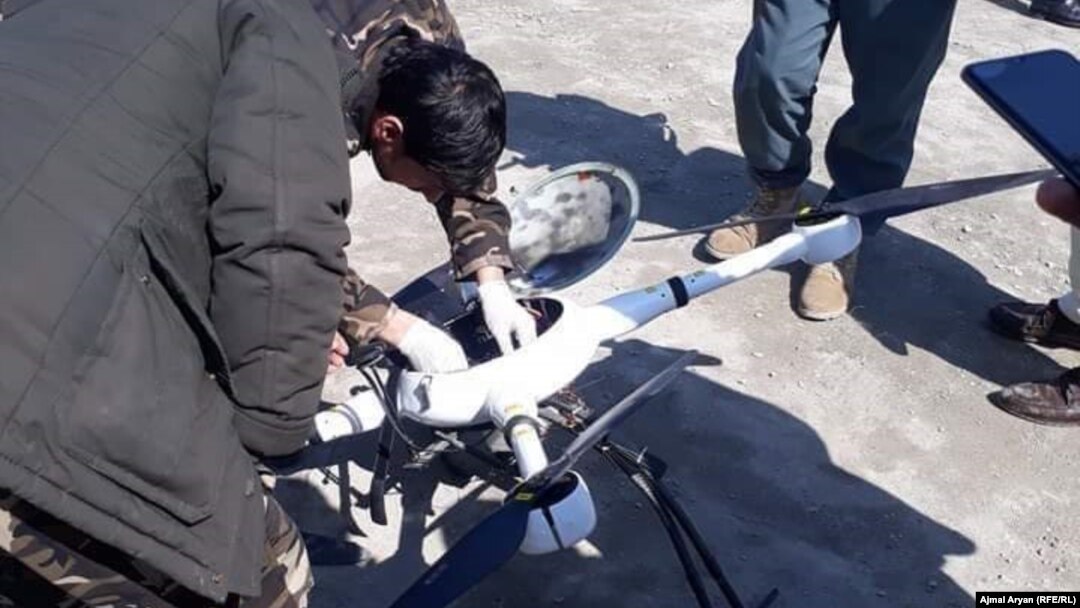 Afghan forces dismantle a Taliban drone shot down in Kunduz Province in March 2020.