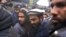 Pakistani security personnel escort Zakiur Rehman Lakhvi (center), the alleged mastermind of the 2008 Mumbai attacks, as he leaves a court in Islamabad in 2014.